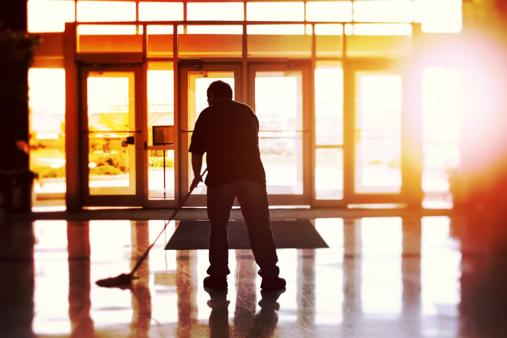 Janitor mopping an office floor